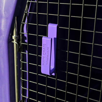 A purple mate crate large dog leash door hook made to hold multiple long lines and leashed attached to the door of a mate crate